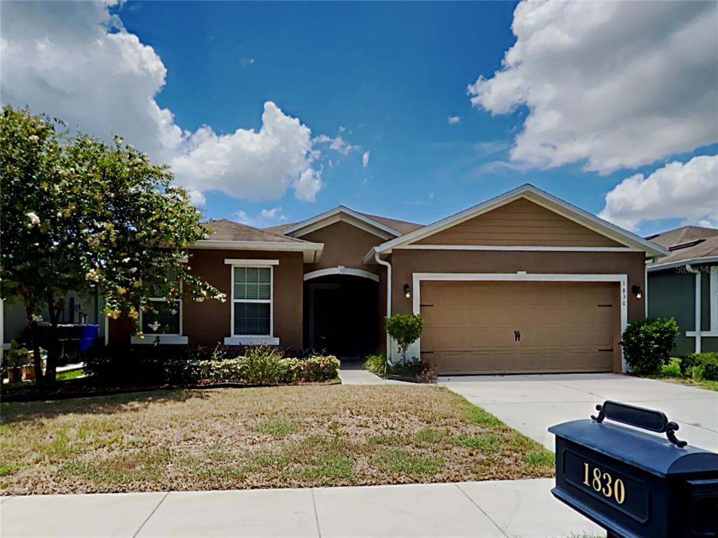 1830 Blount Trail St. Cloud, FL 34769 - Photo 1 of 1 a front view of a house with a yard