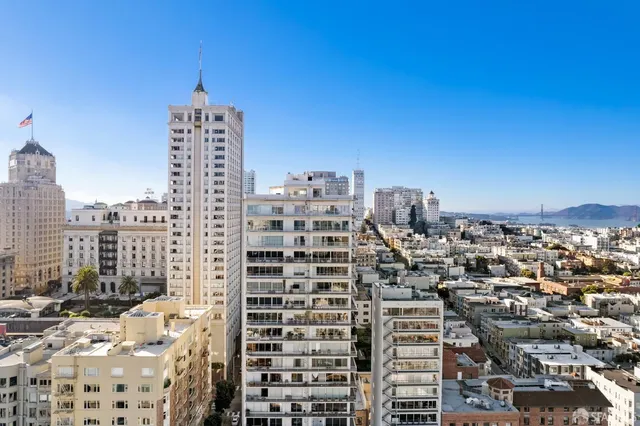 a view of a city with tall buildings