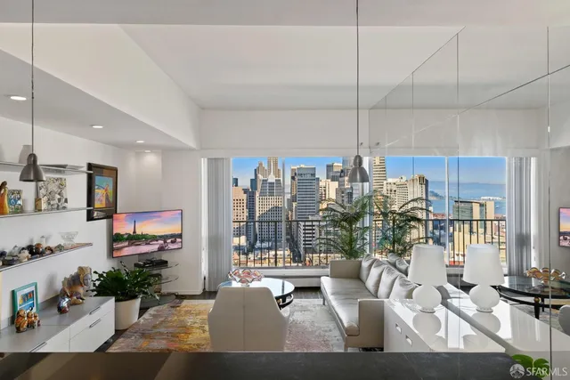 a kitchen with stainless steel appliances a stove microwave and sink