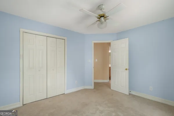 an empty room with fan