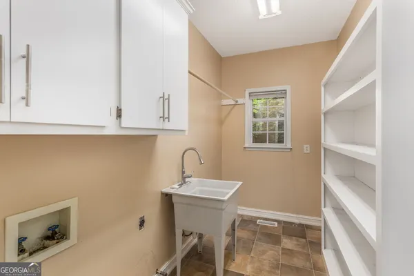 a bathroom with a sink a mirror and a toilet