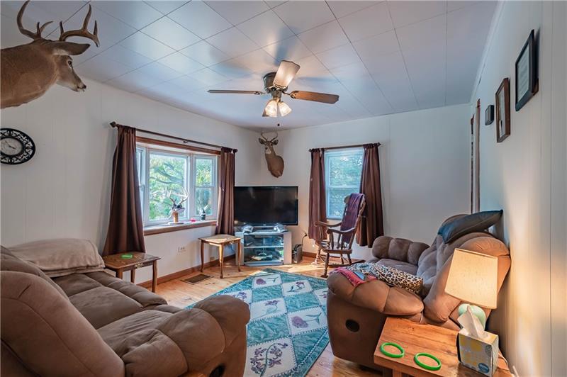 1483 Ridge Road Apollo, PA 15613 - Photo 12 of 20 Lovely family room with lots of light and beautiful hardwood floors.