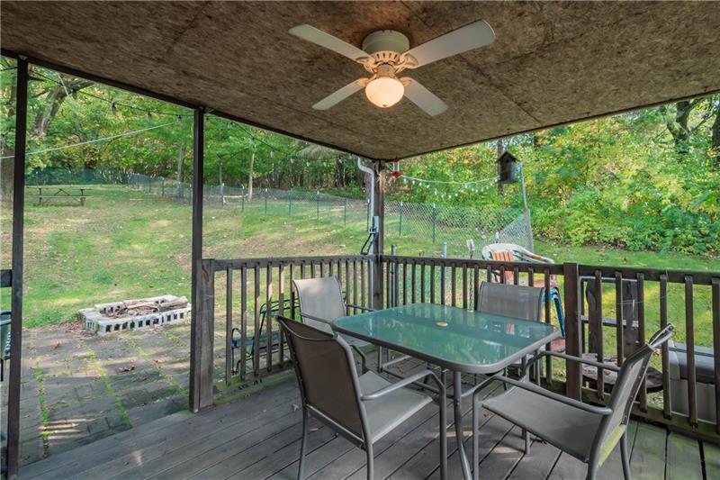 1483 Ridge Road Apollo, PA 15613 - Photo 9 of 20 Side porch has a fan to keep you cool in the heat of the summer. The adjacent fire pit will keep you warm in the cool weather!