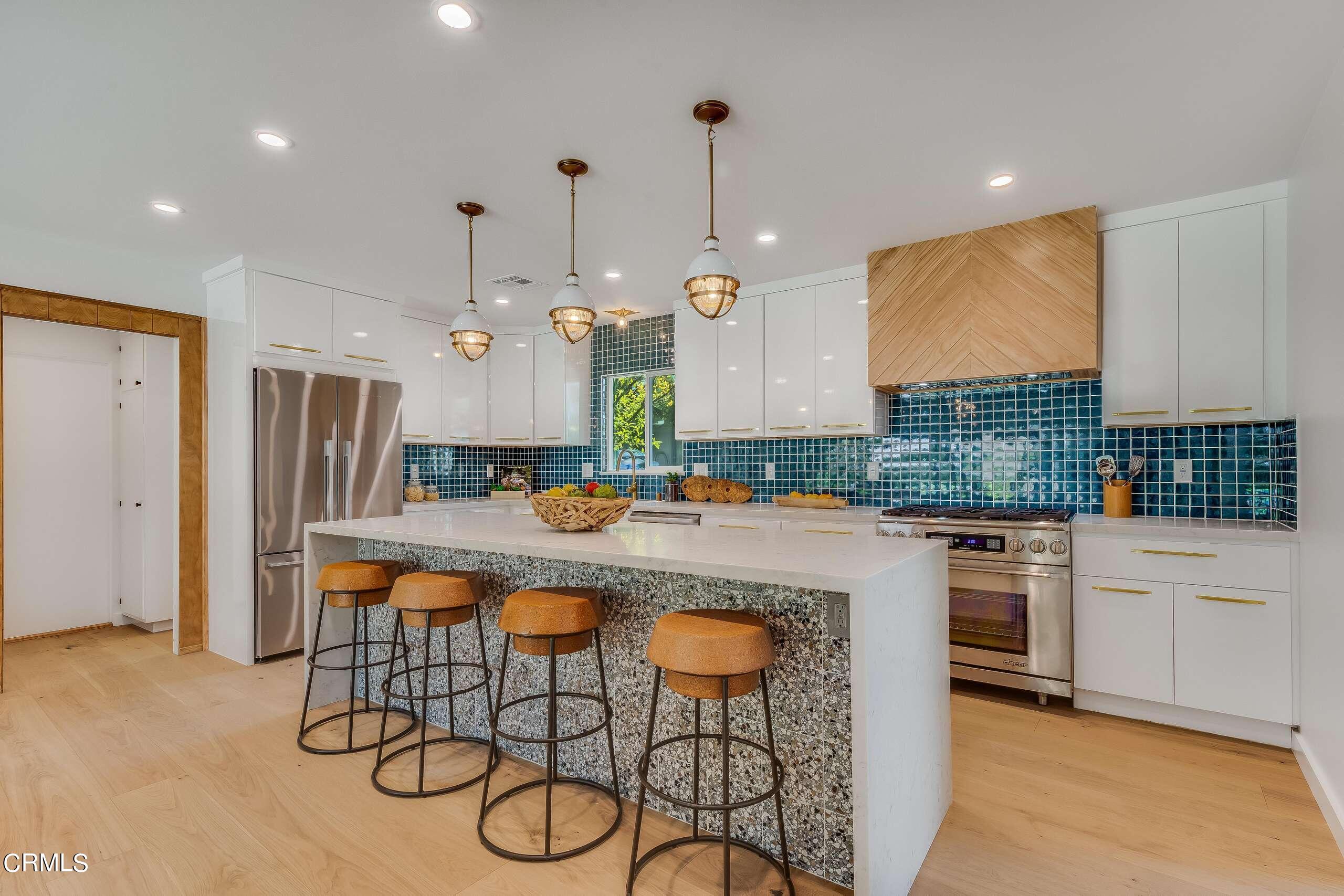 215 Highlawn Place Altadena, CA 91001 - Photo 13 of 38 a kitchen with a table chairs stove and cabinets