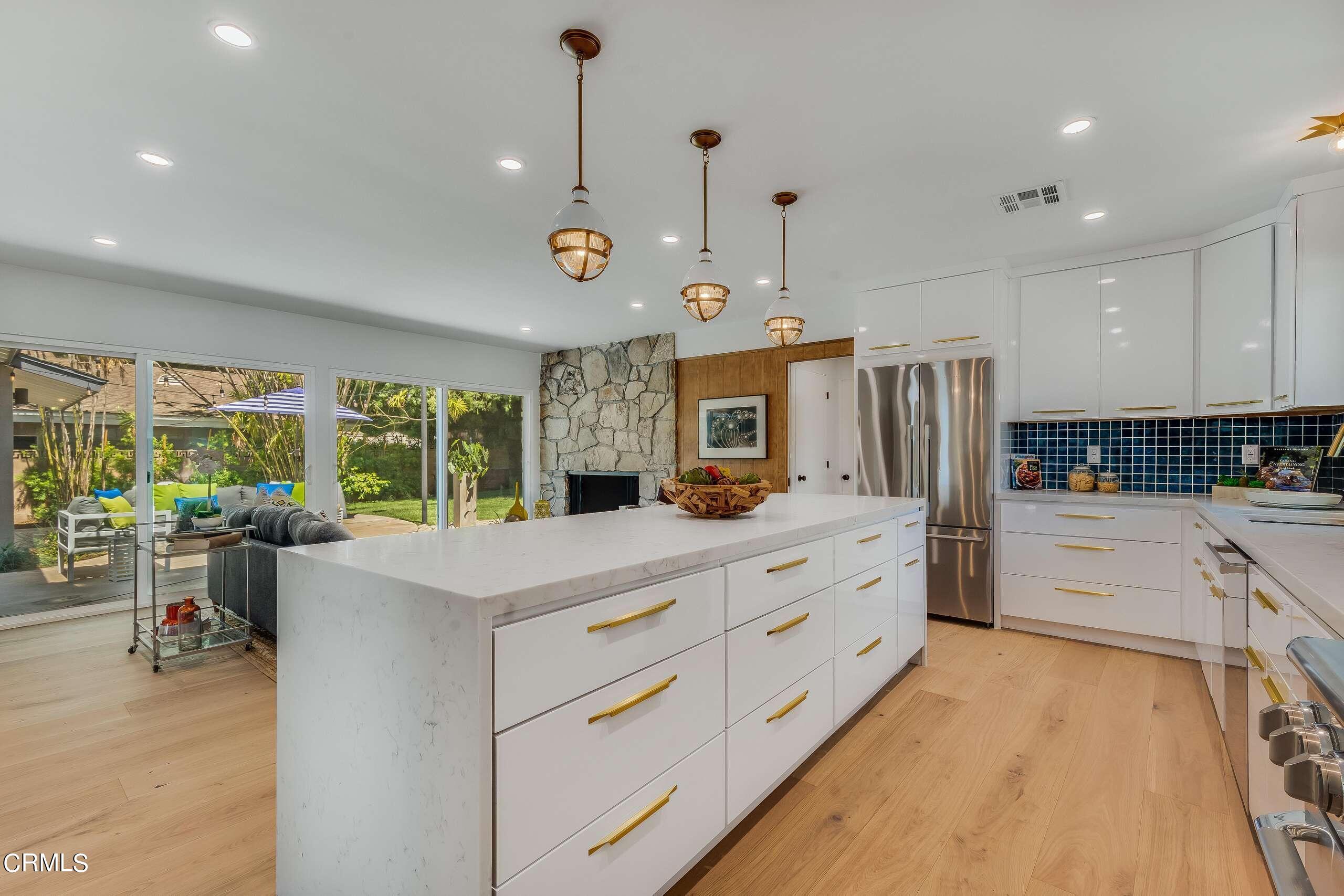 215 Highlawn Place Altadena, CA 91001 - Photo 15 of 38 a large white kitchen with a large window a oven and stainless steel appliances
