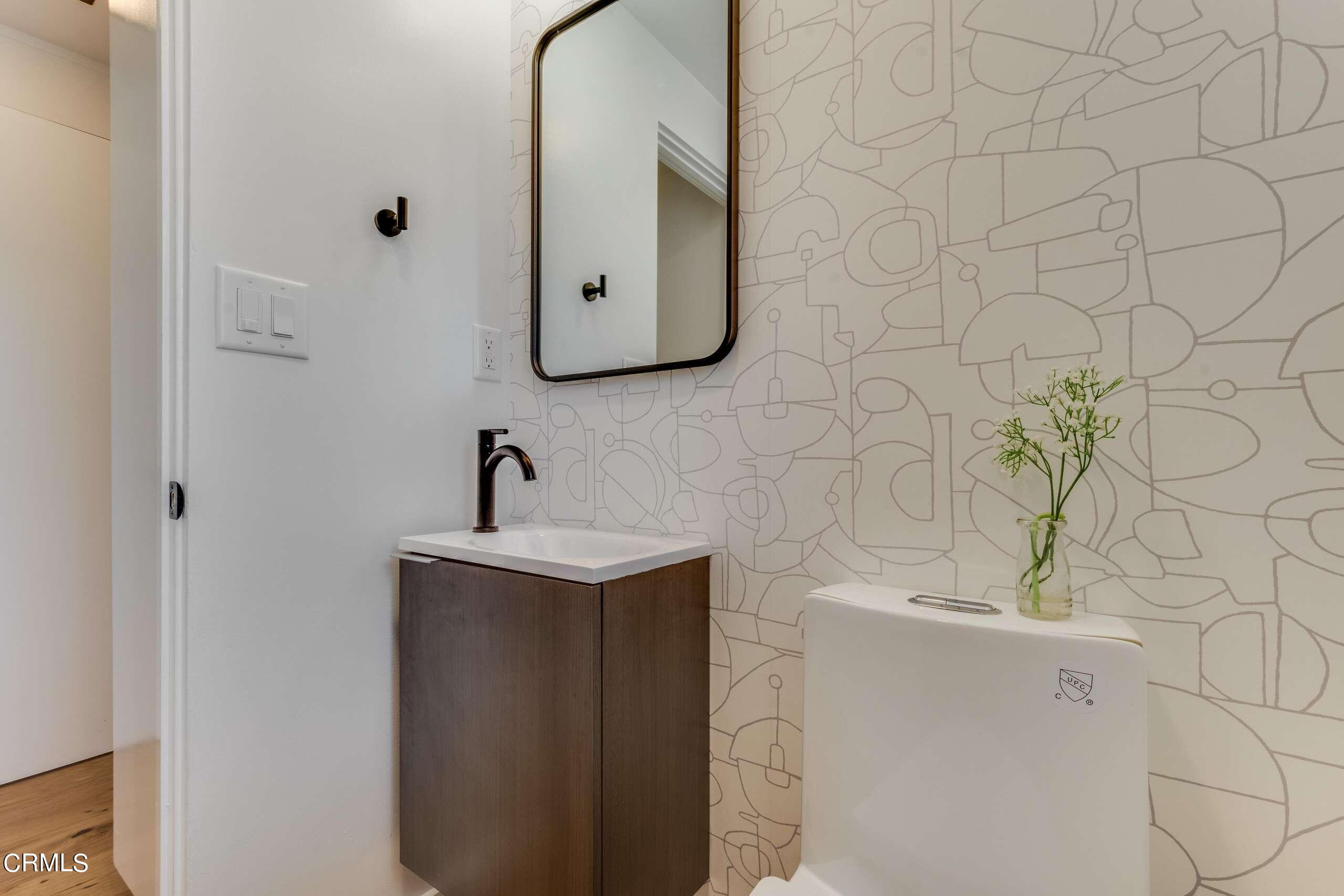 215 Highlawn Place Altadena, CA 91001 - Photo 18 of 38 a bathroom with a sink and mirror