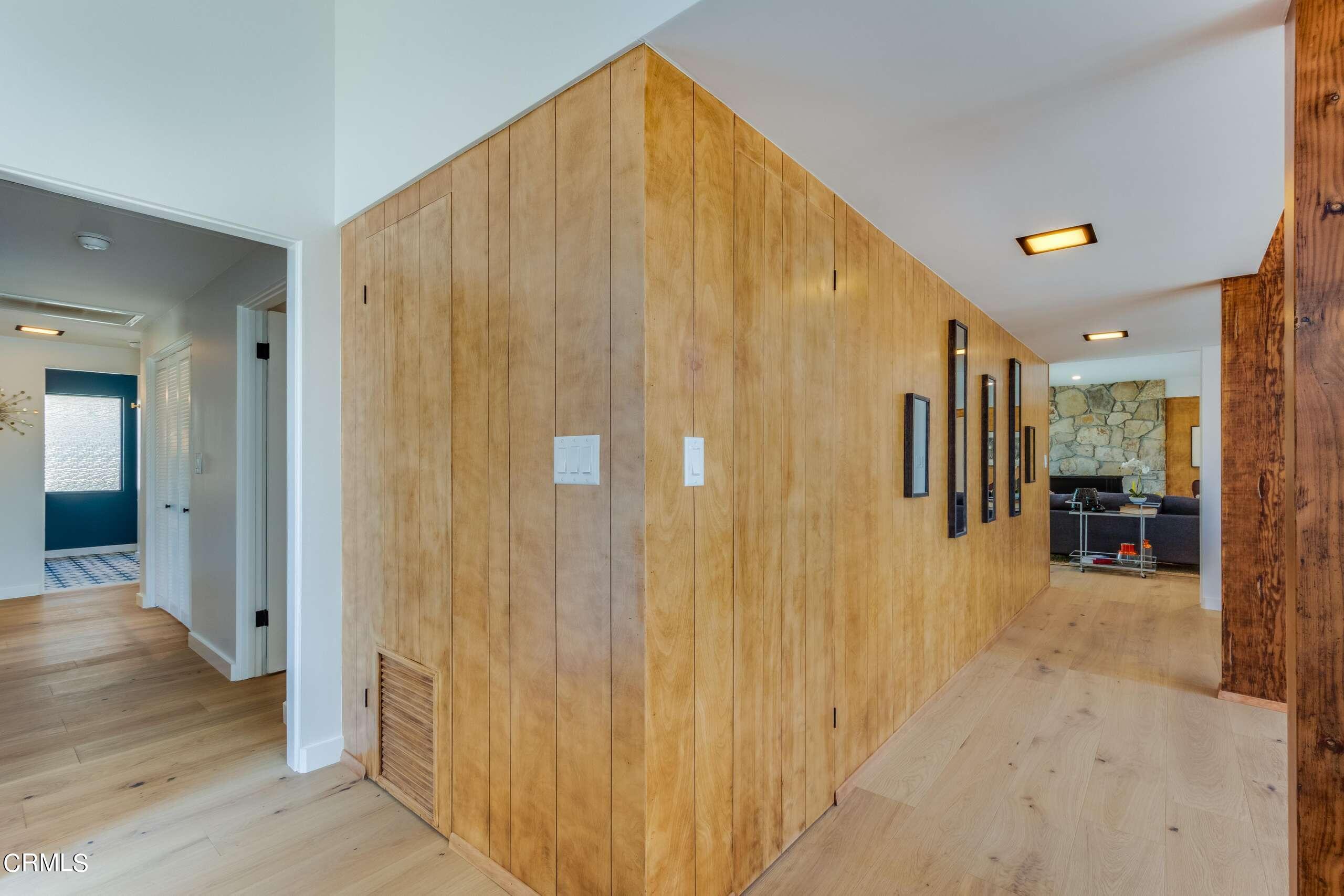 215 Highlawn Place Altadena, CA 91001 - Photo 20 of 38 a view of a hallway with wooden staircase