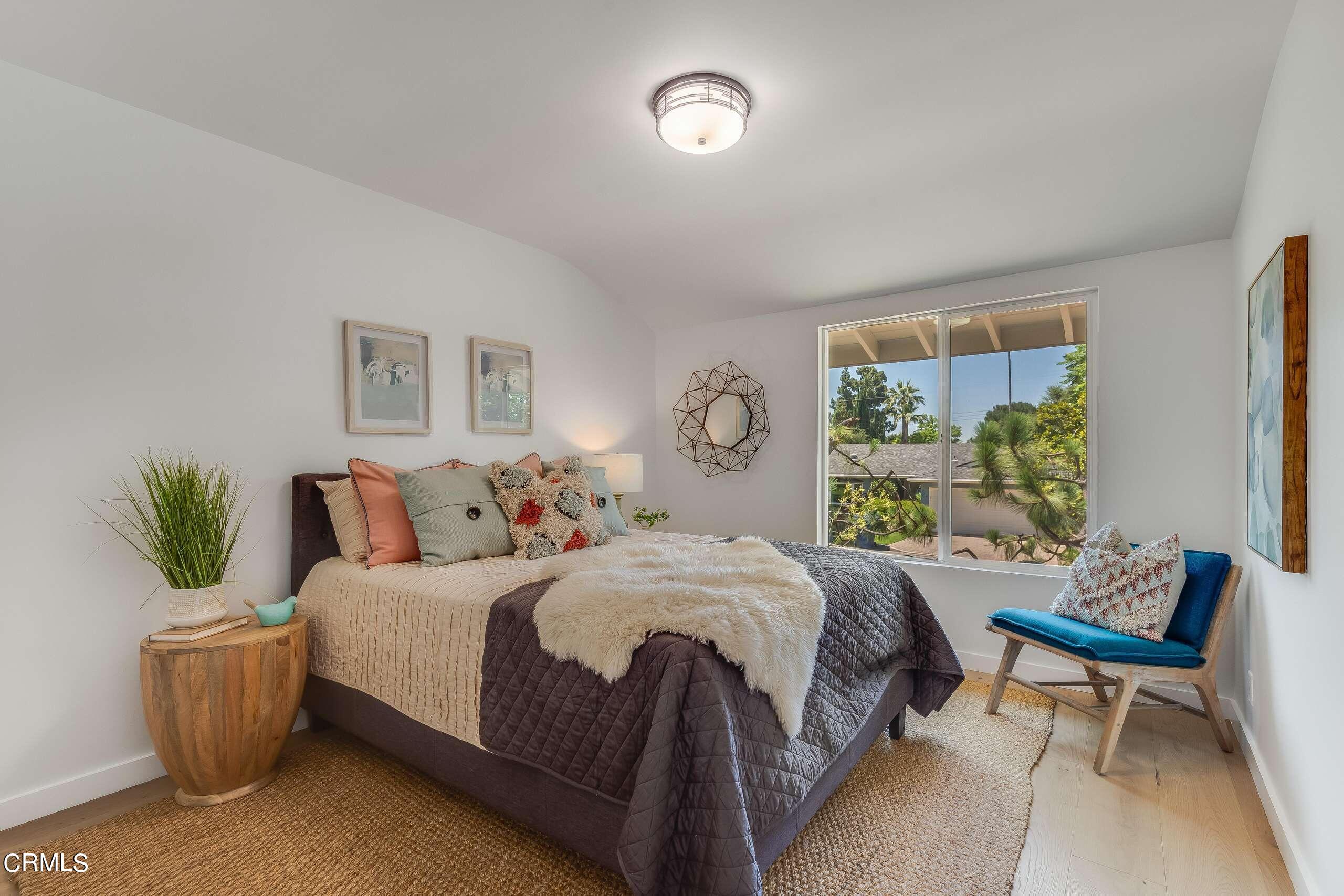 215 Highlawn Place Altadena, CA 91001 - Photo 22 of 38 a bedroom with a bed and a window
