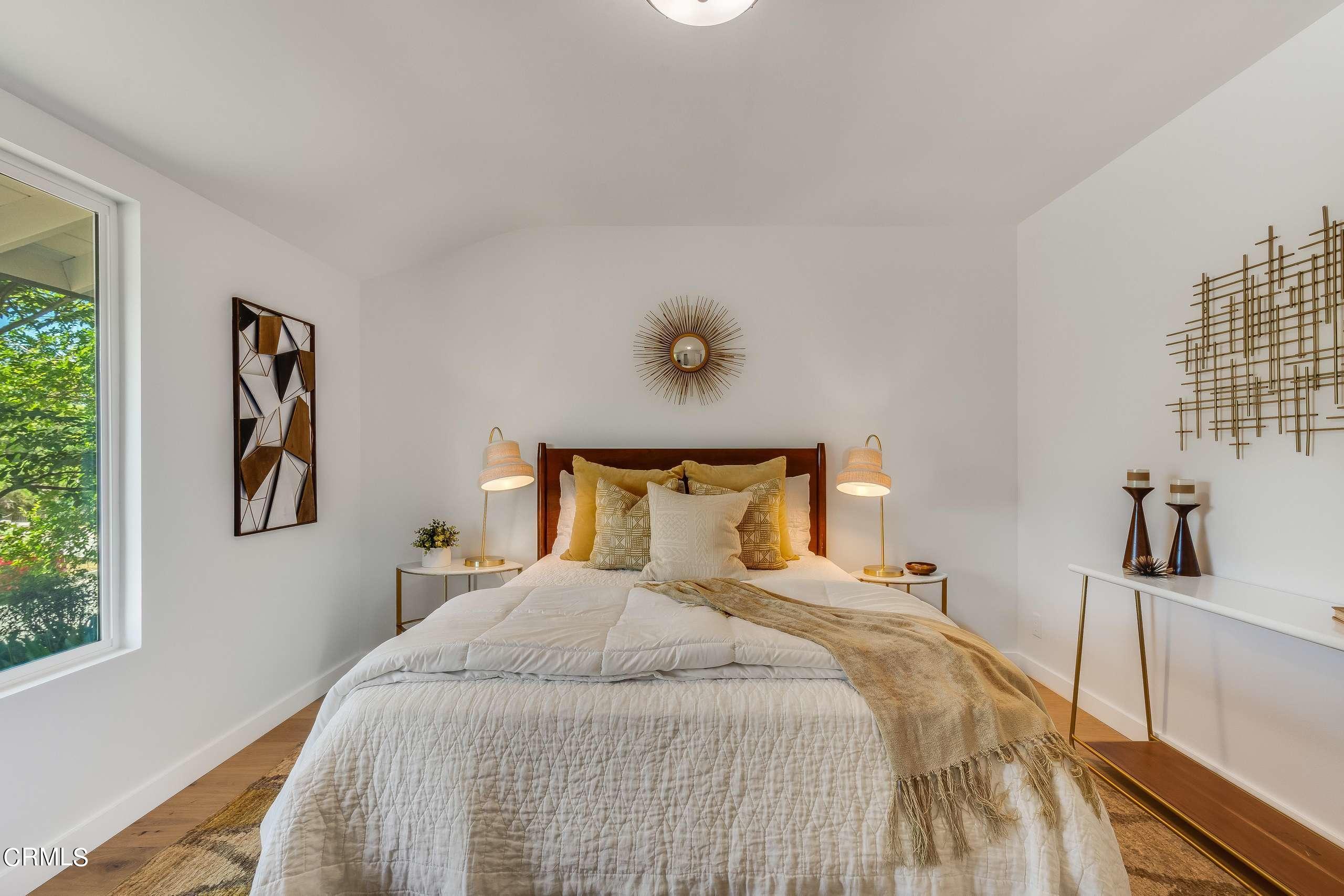 215 Highlawn Place Altadena, CA 91001 - Photo 23 of 38 a bedroom with a bed and a window