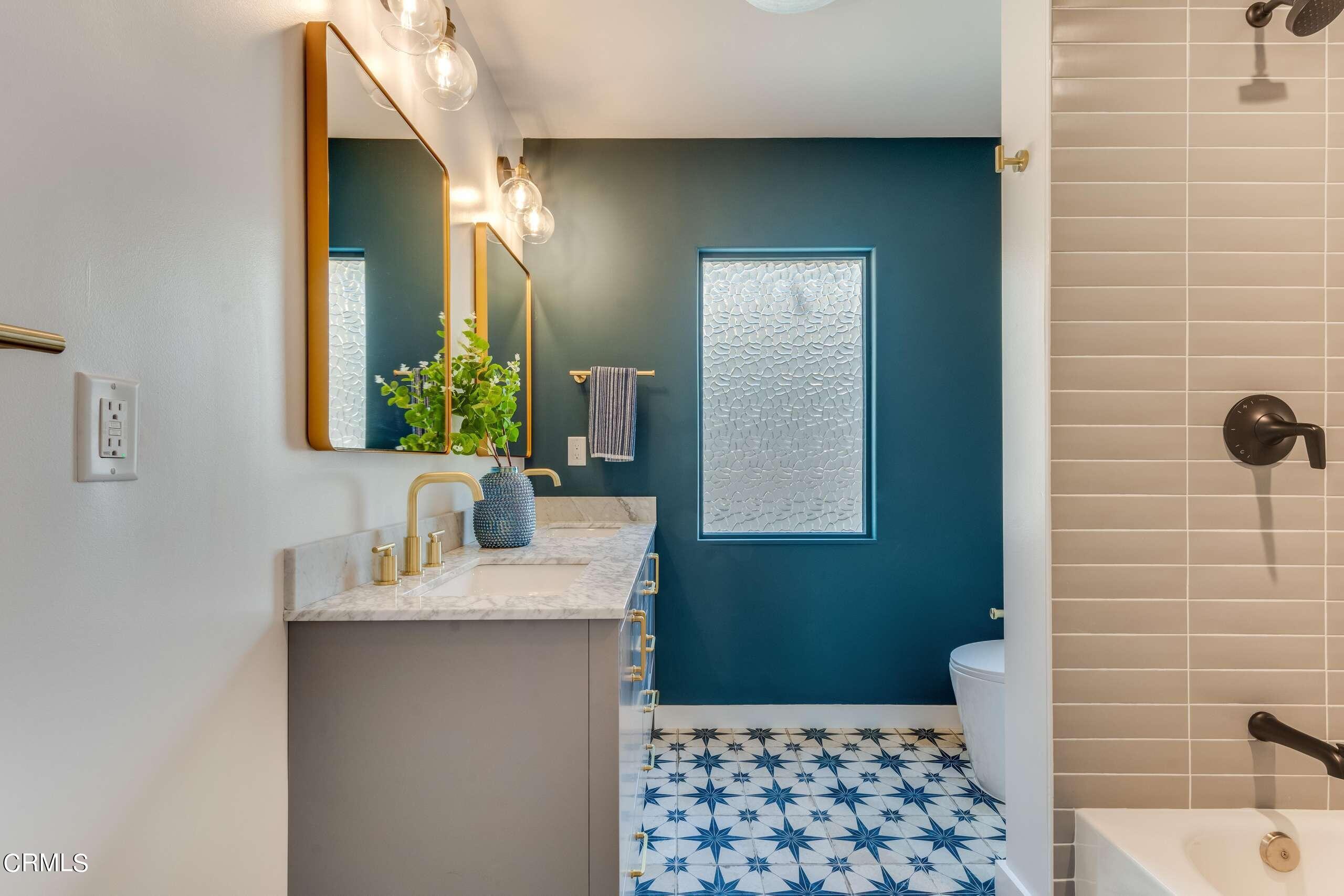 215 Highlawn Place Altadena, CA 91001 - Photo 25 of 38 a bathroom with a sink a toilet and mirror
