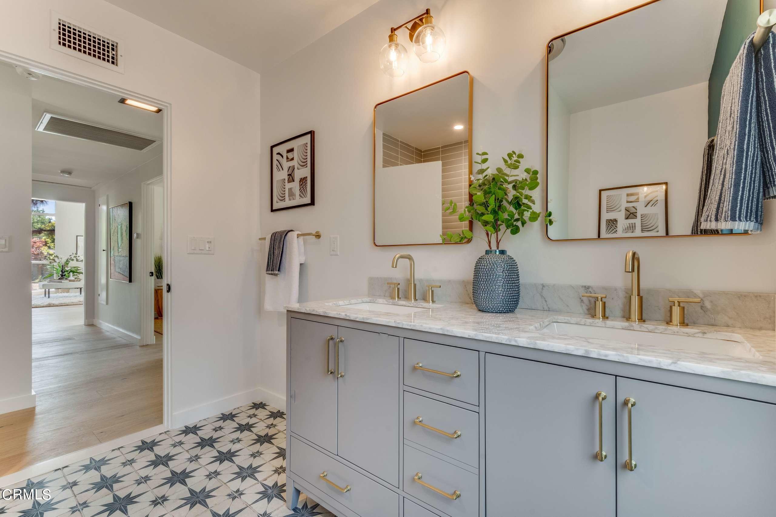 215 Highlawn Place Altadena, CA 91001 - Photo 26 of 38 a bathroom with a sink and a mirror