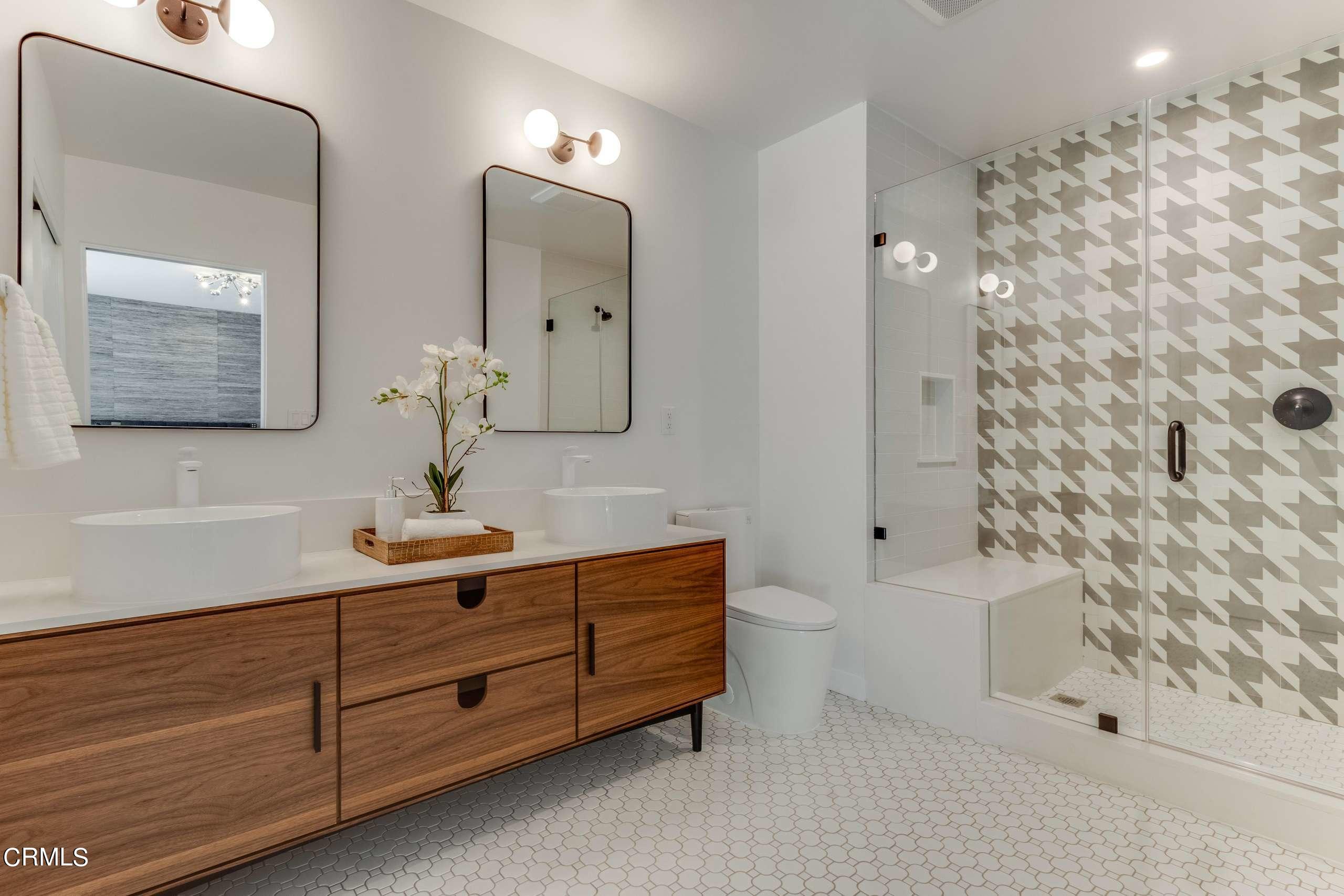 215 Highlawn Place Altadena, CA 91001 - Photo 31 of 38 a bathroom with a sink and a mirror