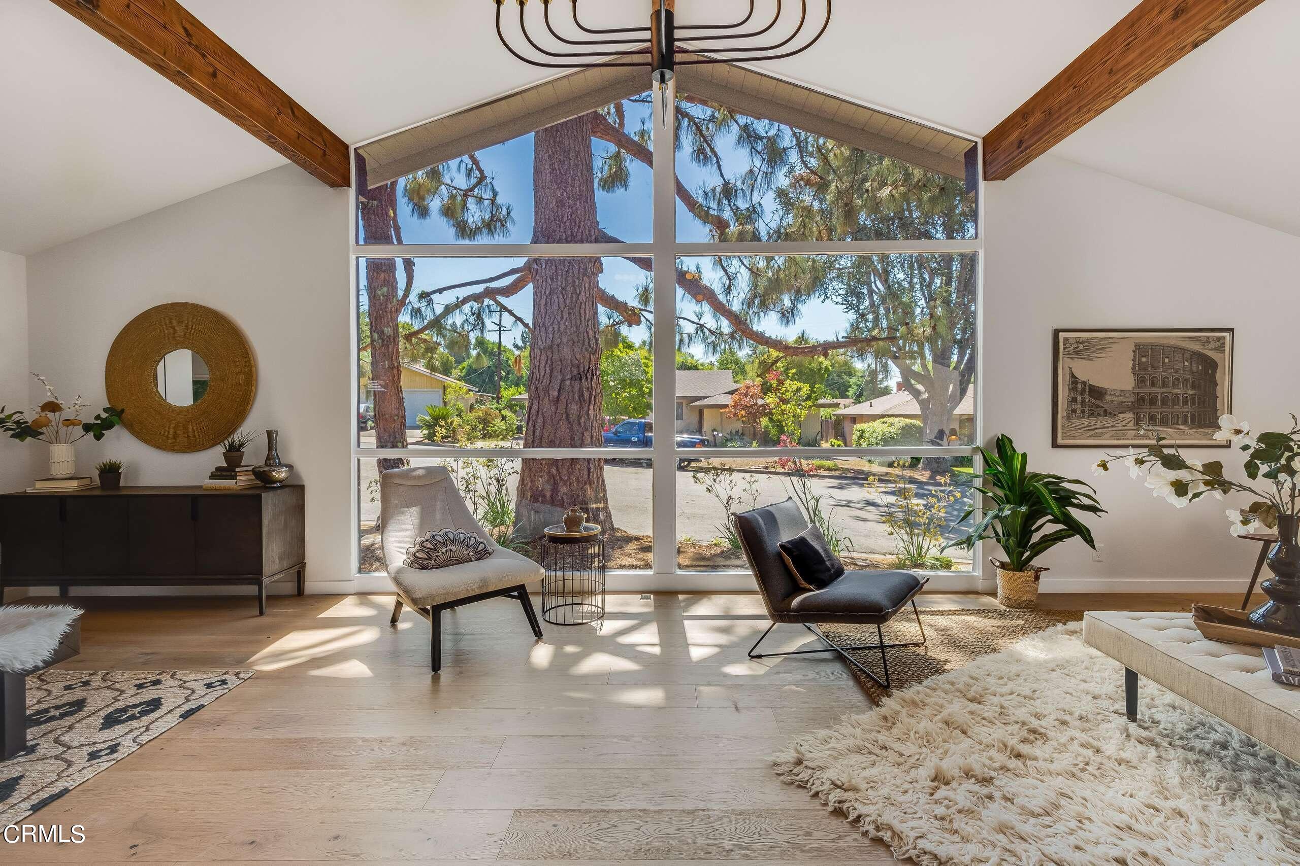 215 Highlawn Place Altadena, CA 91001 - Photo 5 of 38 a living room with furniture a floor to ceiling window and a flat screen tv