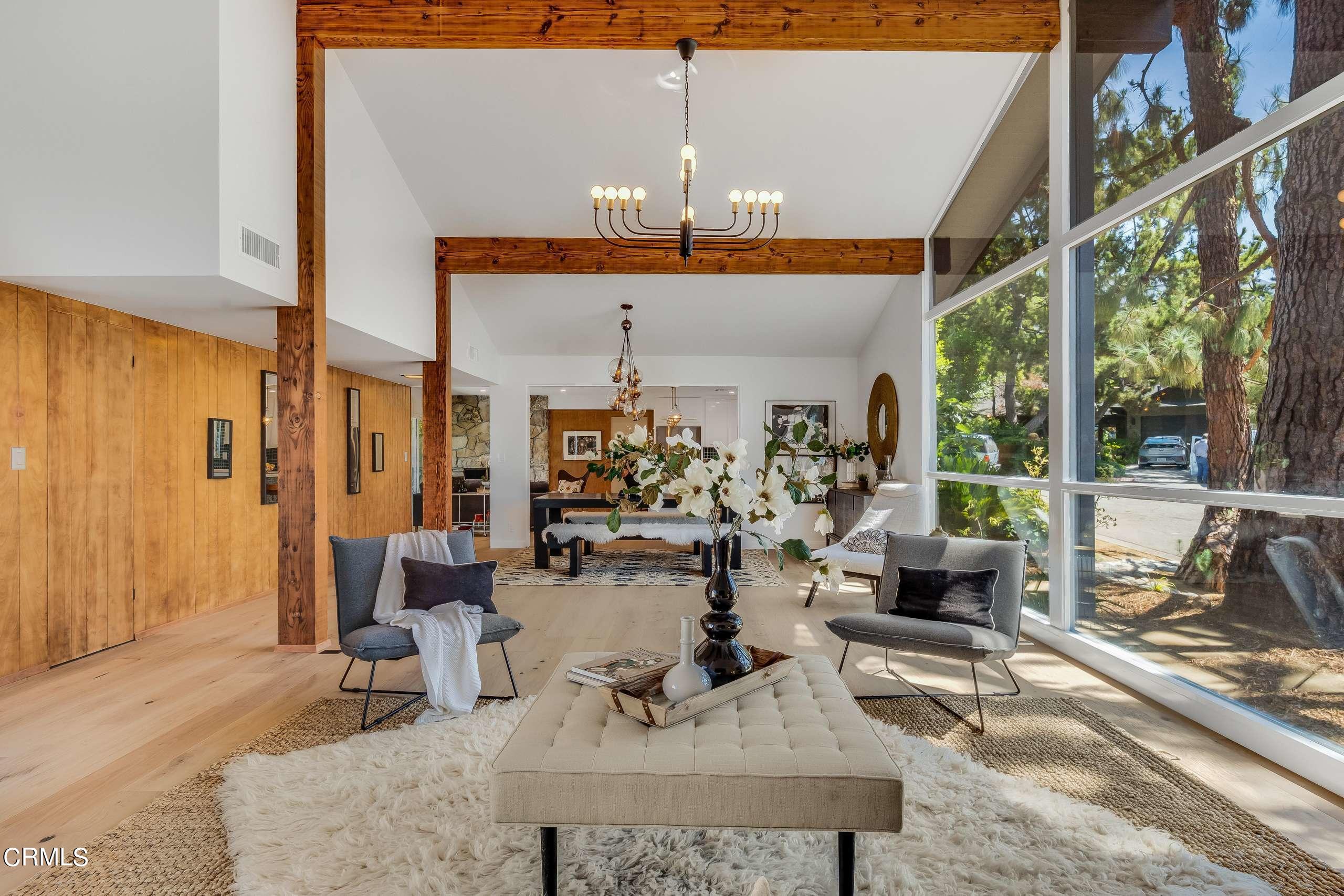 215 Highlawn Place Altadena, CA 91001 - Photo 7 of 38 a living room with patio furniture and a chandelier