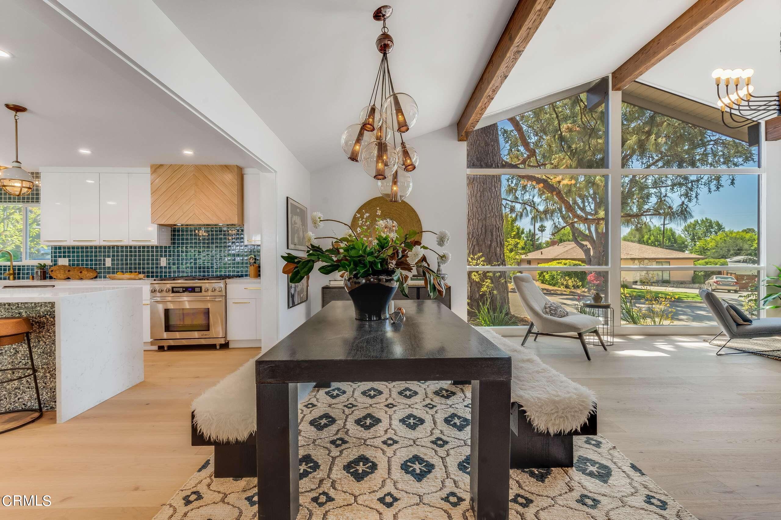 215 Highlawn Place Altadena, CA 91001 - Photo 9 of 38 a dining room with a large window table and chairs