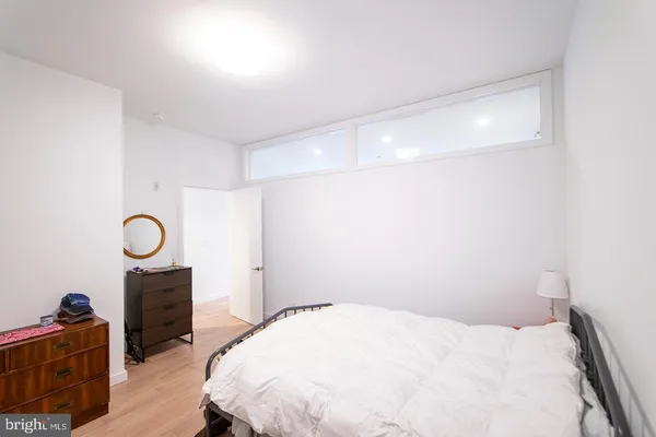 a bedroom with a bed and a cabinets