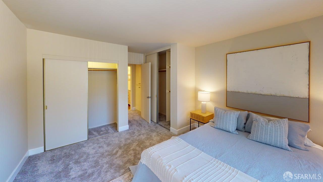 1305 Webster Street, Unit C309 Alameda, CA 94501 - Photo 12 of 24 a bedroom with a bed and wooden floor