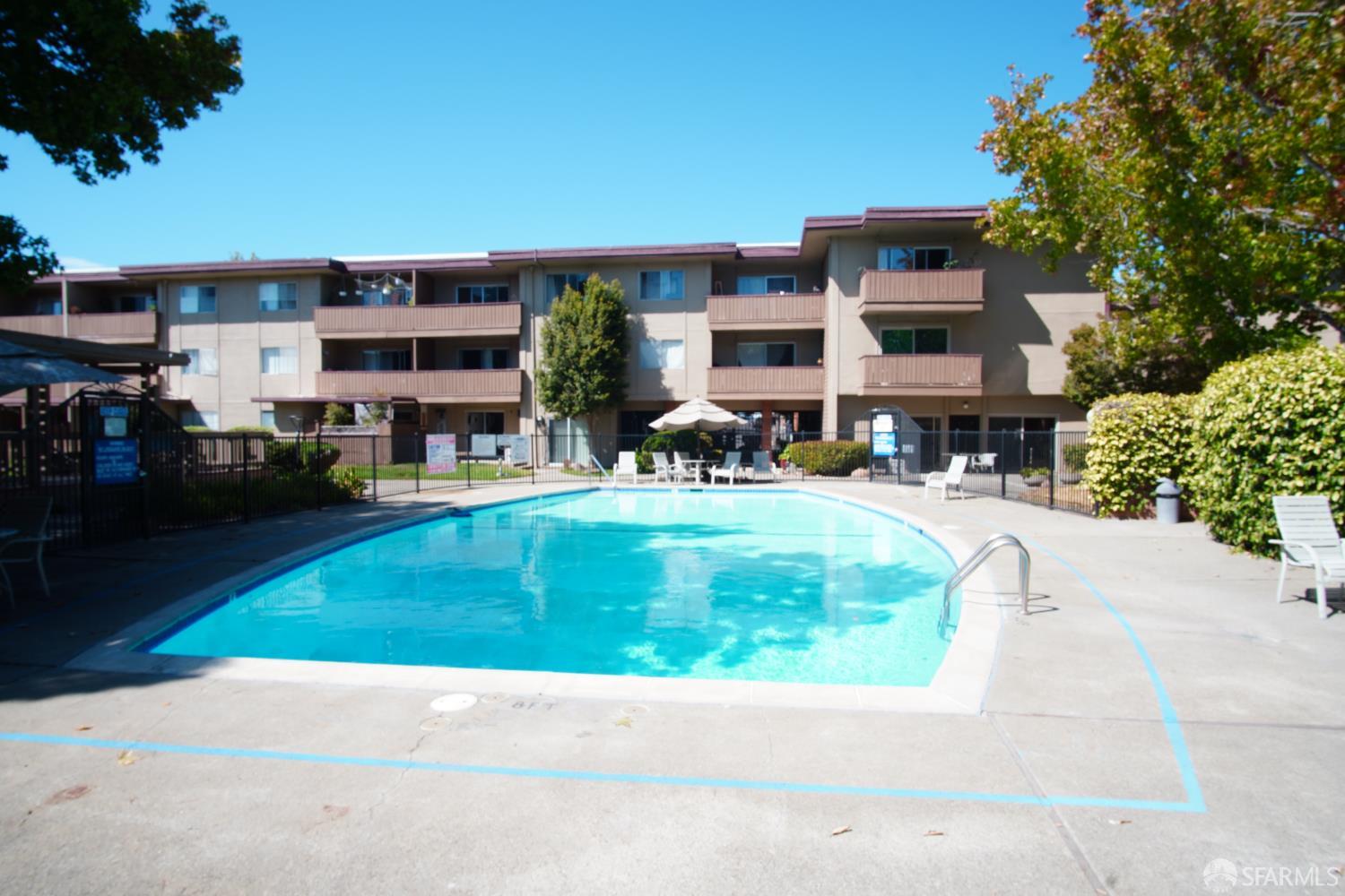 1305 Webster Street, Unit C309 Alameda, CA 94501 - Photo 16 of 24 a view of a building with a yard