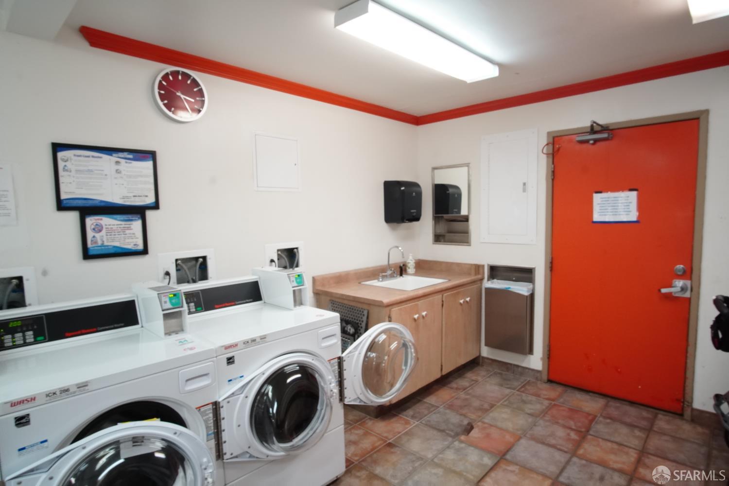 1305 Webster Street, Unit C309 Alameda, CA 94501 - Photo 17 of 24 a utility room with dryer and washer