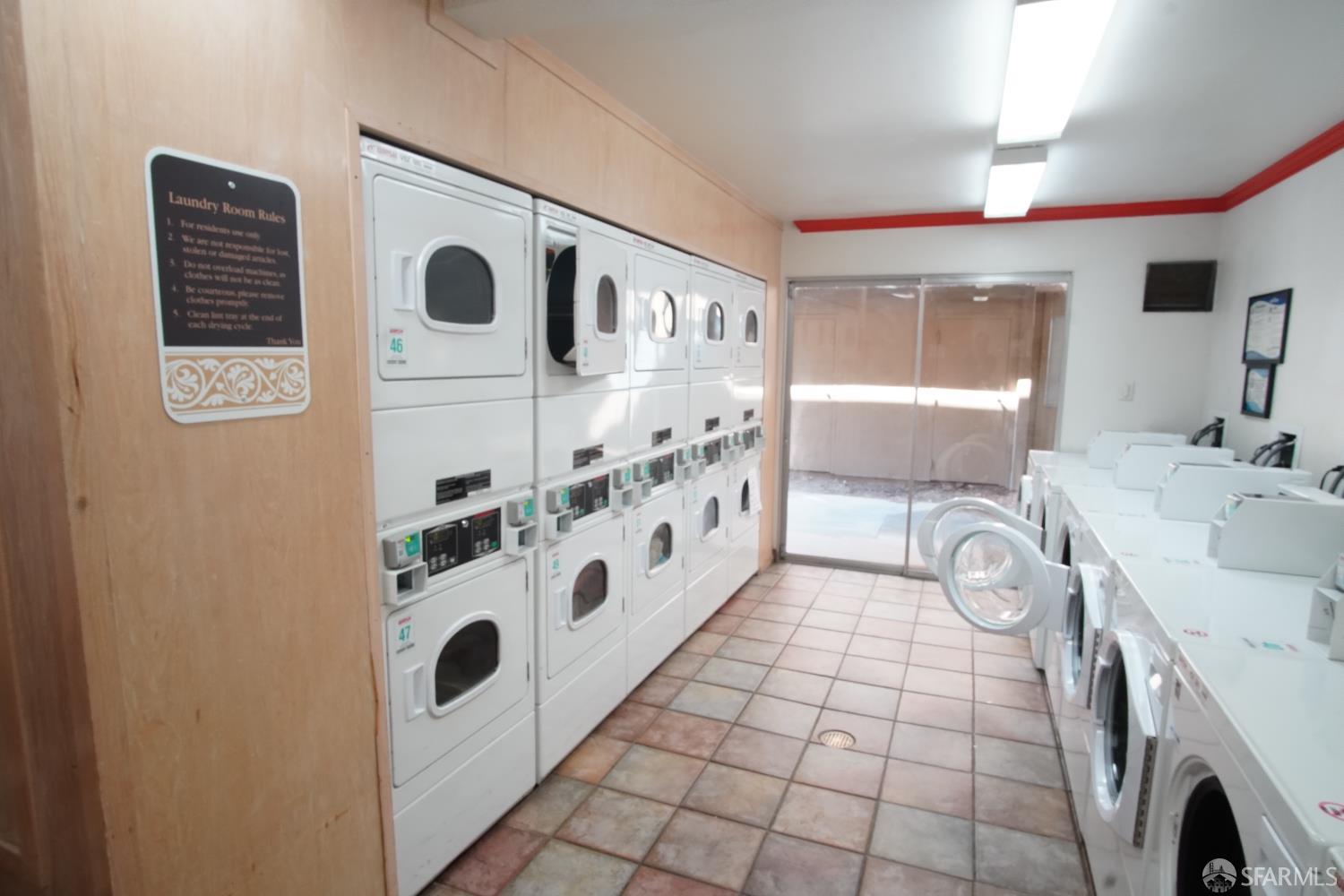 1305 Webster Street, Unit C309 Alameda, CA 94501 - Photo 18 of 24 a bathroom with a sink a mirror and a shower
