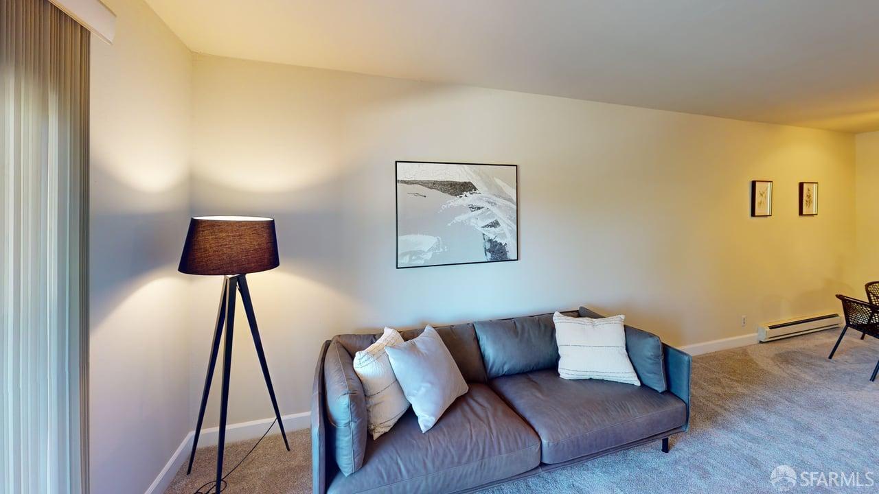 1305 Webster Street, Unit C309 Alameda, CA 94501 - Photo 2 of 24 a living room with couch and a lamp