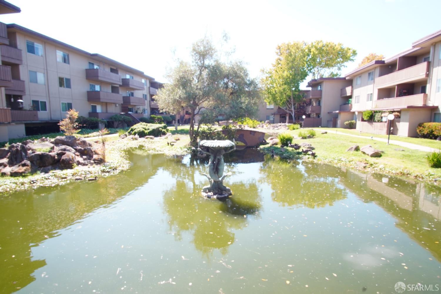 1305 Webster Street, Unit C309 Alameda, CA 94501 - Photo 21 of 24 a view of a swimming pool with outdoor seating