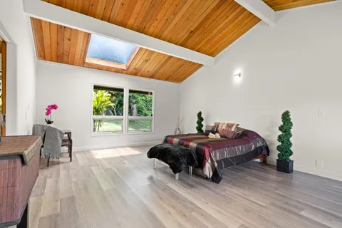 a bed room with furniture and a window