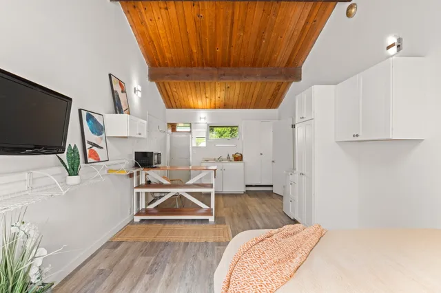 a room with furniture and a flat screen tv