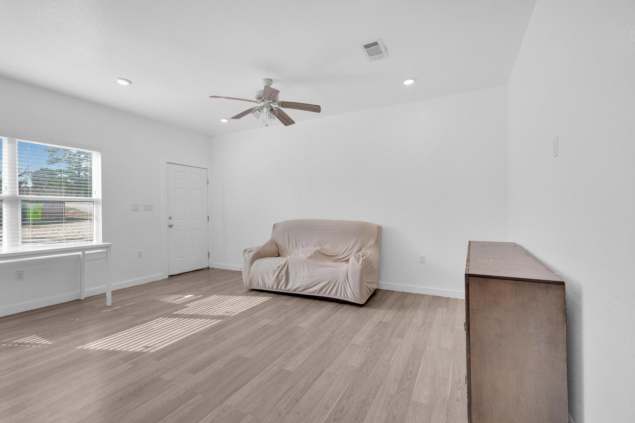 114 Crepe Myrtle Parkway Elgin, TX 78621 - Photo 7 of 40 Unit A - Living area with light wood-style flooring, a ceiling fan, and recessed lighting