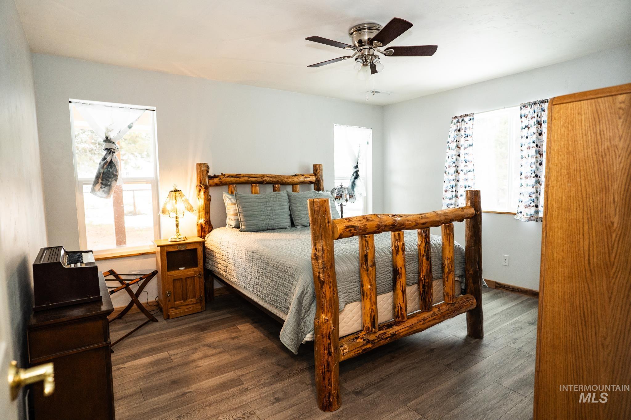 22 West Prospectors Drive Cascade, ID 83611 - Photo 22 of 29 Bedroom featuring dark wood finished floors and a ceiling fan