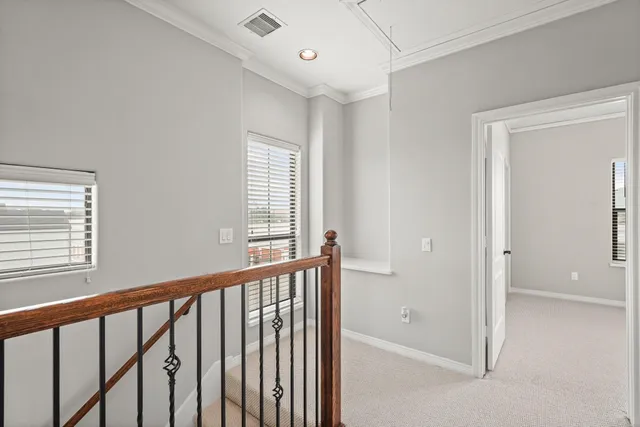 a view of a hallway with windows