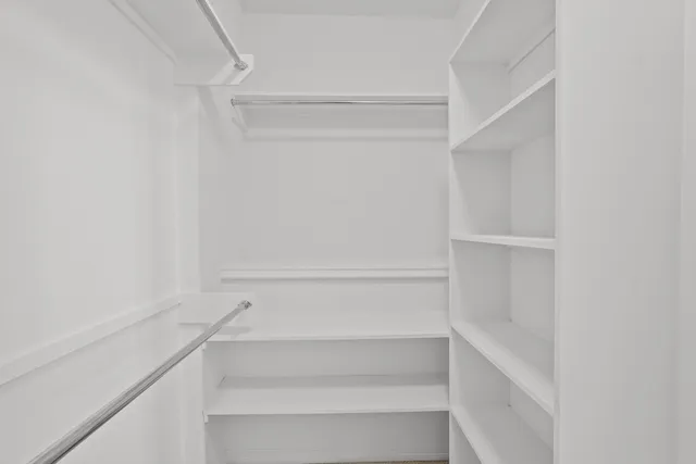 a bathroom with a tub a toilet and a sink