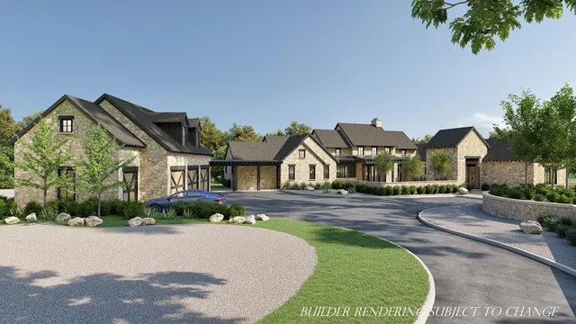 a front view of a house with a garden and yard