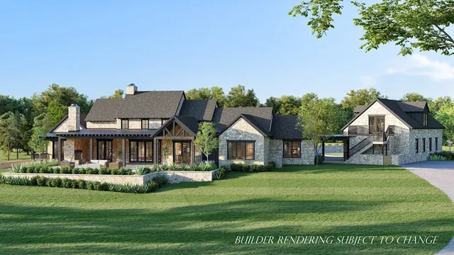 a front view of a residential houses with yard and green space