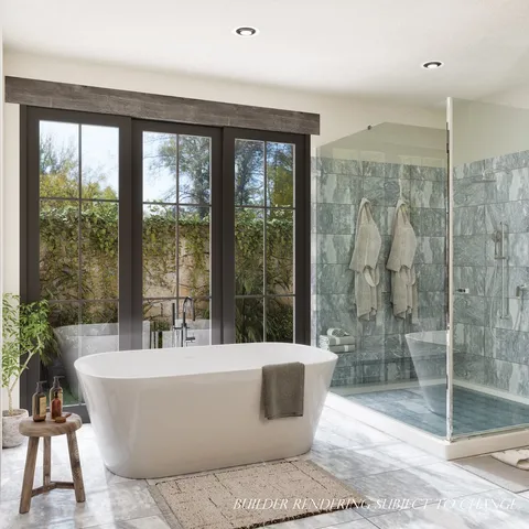 a living room with a large window and a glass door