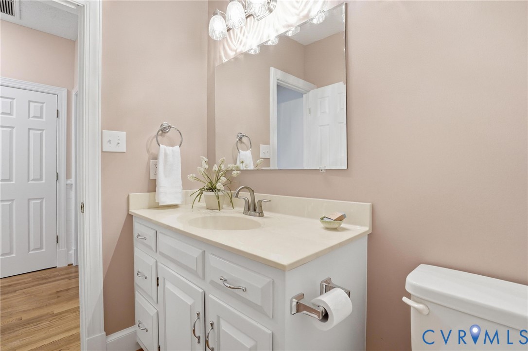 12123 Deer Ridge Court Ashland, VA 23005 - Photo 29 of 63 a bathroom with a sink a toilet and a mirror
