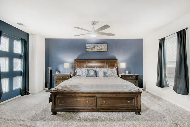 a bedroom with a bed and a table in it