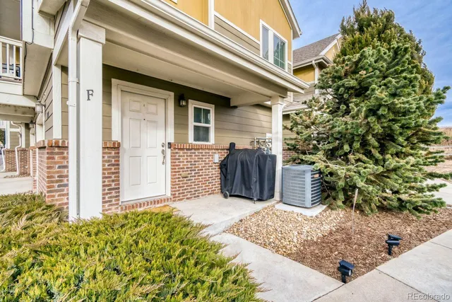 a view of a house with a flower garden