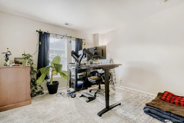 a view of a workspace with furniture