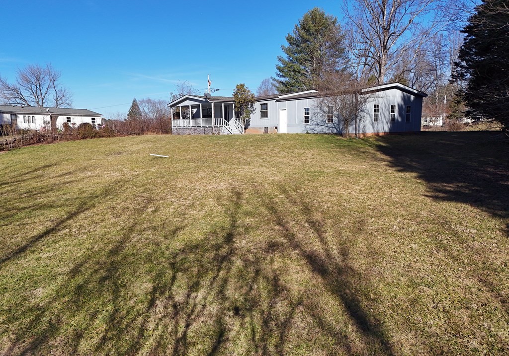 253 Windy Lane Hiawassee, GA 30546 - Photo 12 of 65 a view of a house with a yard
