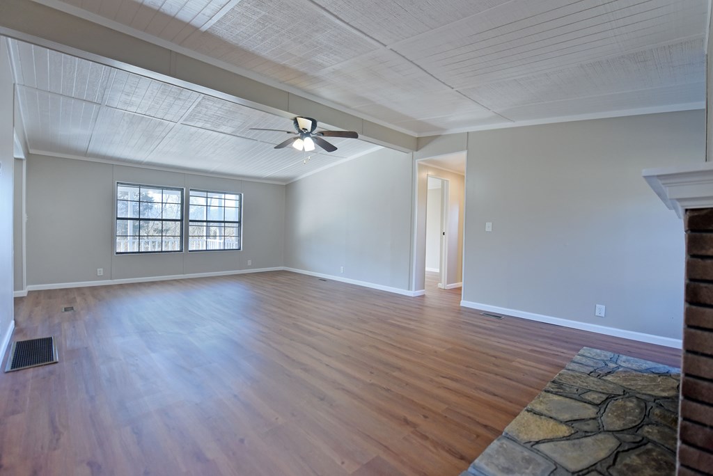 253 Windy Lane Hiawassee, GA 30546 - Photo 21 of 65 wooden floor in an empty room with a window