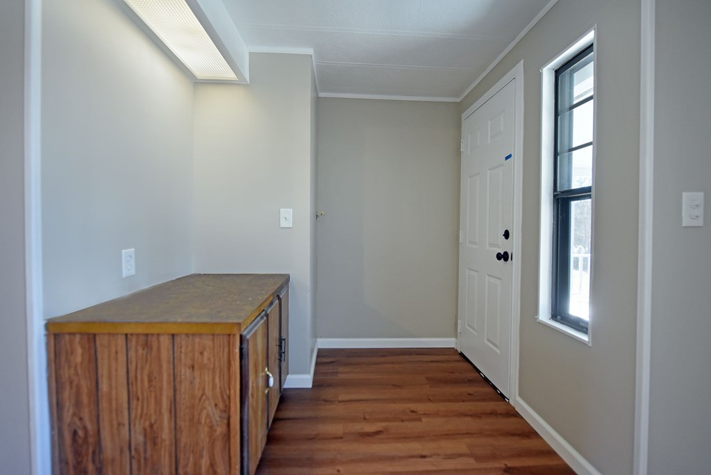 253 Windy Lane Hiawassee, GA 30546 - Photo 24 of 65 a view of a hallway with wooden floor and closet area