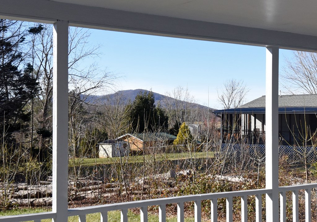 253 Windy Lane Hiawassee, GA 30546 - Photo 26 of 65 a view of a house with a window and wooden fence