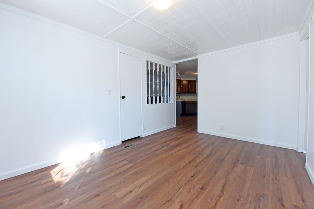 253 Windy Lane Hiawassee, GA 30546 - Photo 39 of 65 a view of an empty room with wooden floor and a window