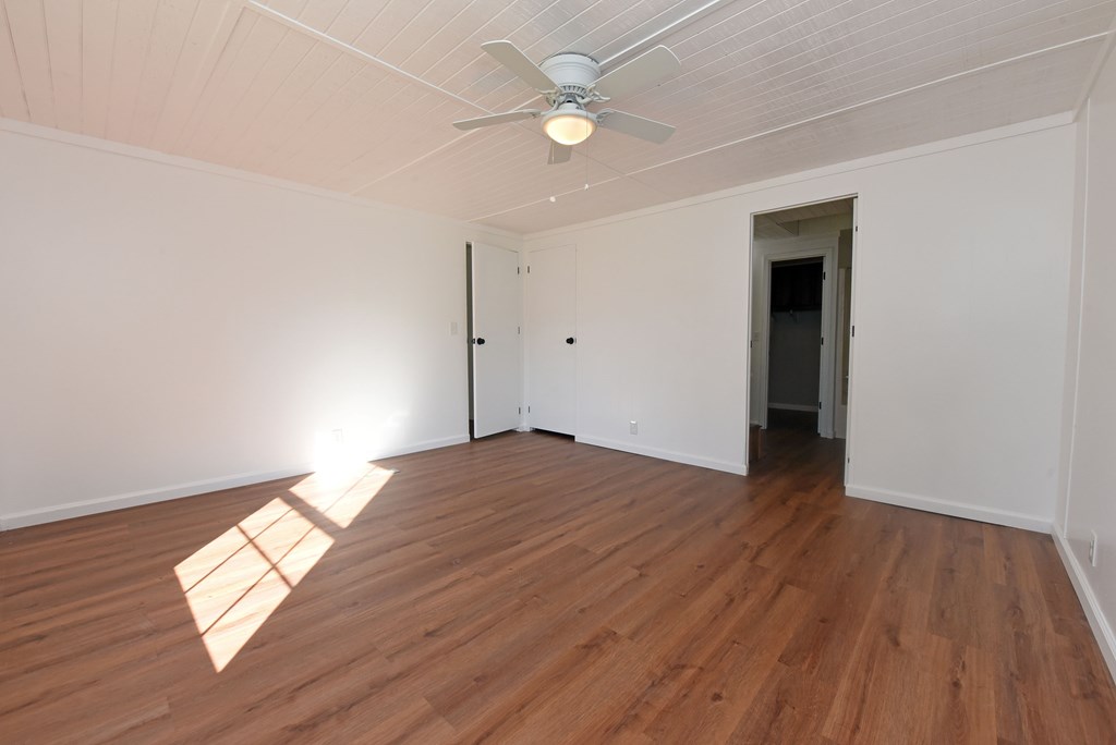 253 Windy Lane Hiawassee, GA 30546 - Photo 46 of 65 a view of empty room with wooden floor and fan