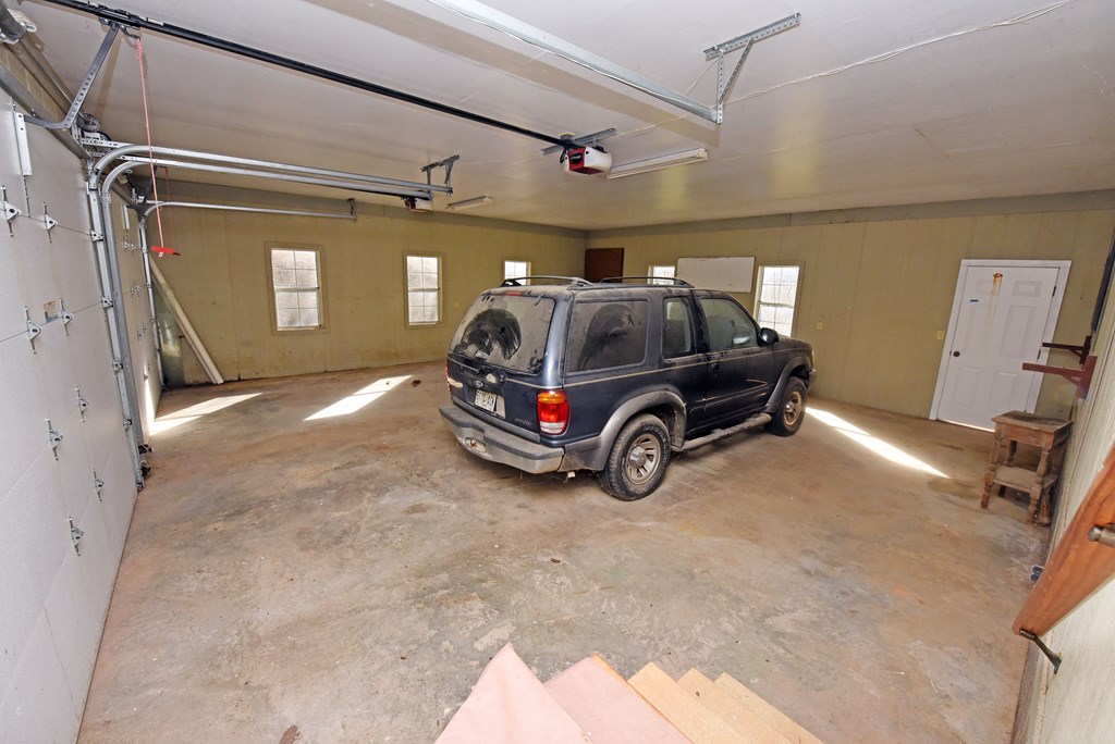 253 Windy Lane Hiawassee, GA 30546 - Photo 47 of 65 a car parked in a garage