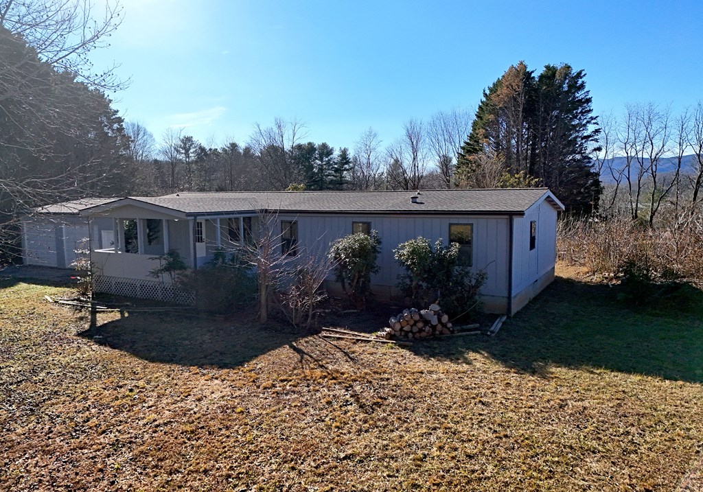 253 Windy Lane Hiawassee, GA 30546 - Photo 7 of 65 a view of a house with a yard