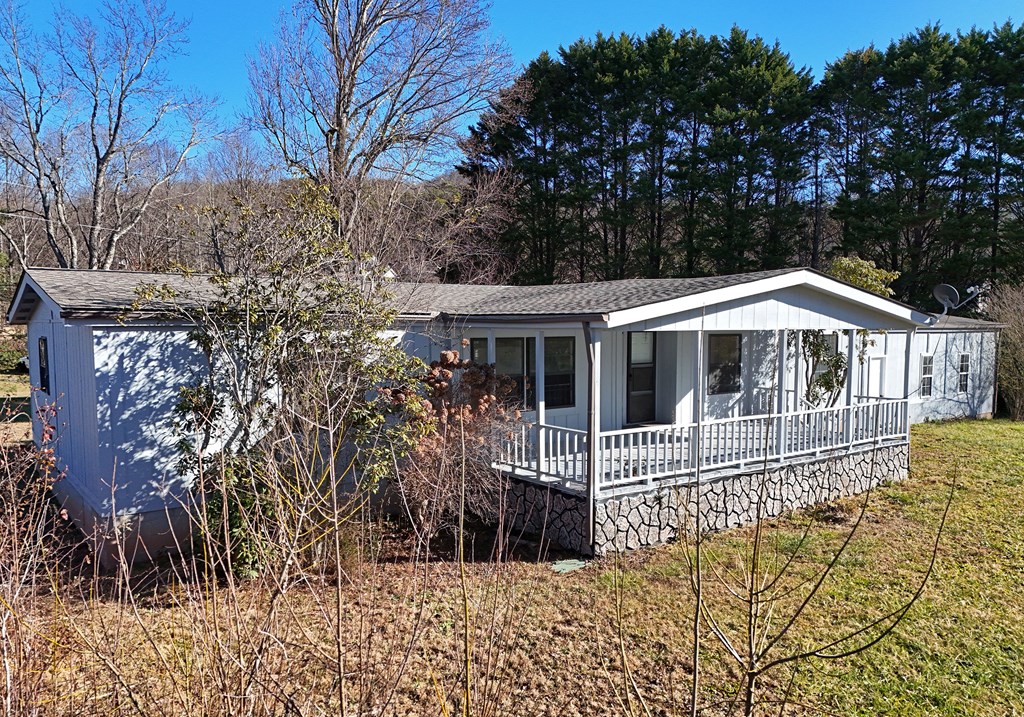 253 Windy Lane Hiawassee, GA 30546 - Photo 8 of 65 a front view of a house with a yard