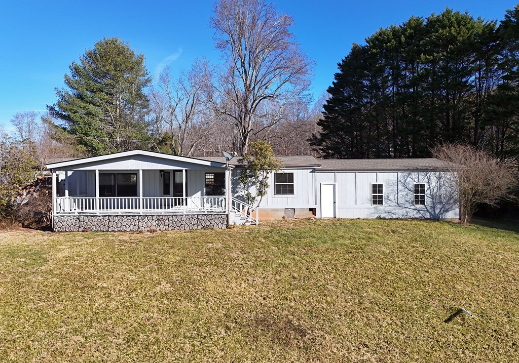 253 Windy Lane Hiawassee, GA 30546 - Photo 9 of 65 a front view of a house with a yard
