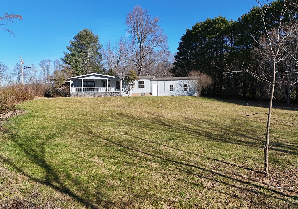 253 Windy Lane Hiawassee, GA 30546 - Photo 10 of 65 a front view of a house with a yard